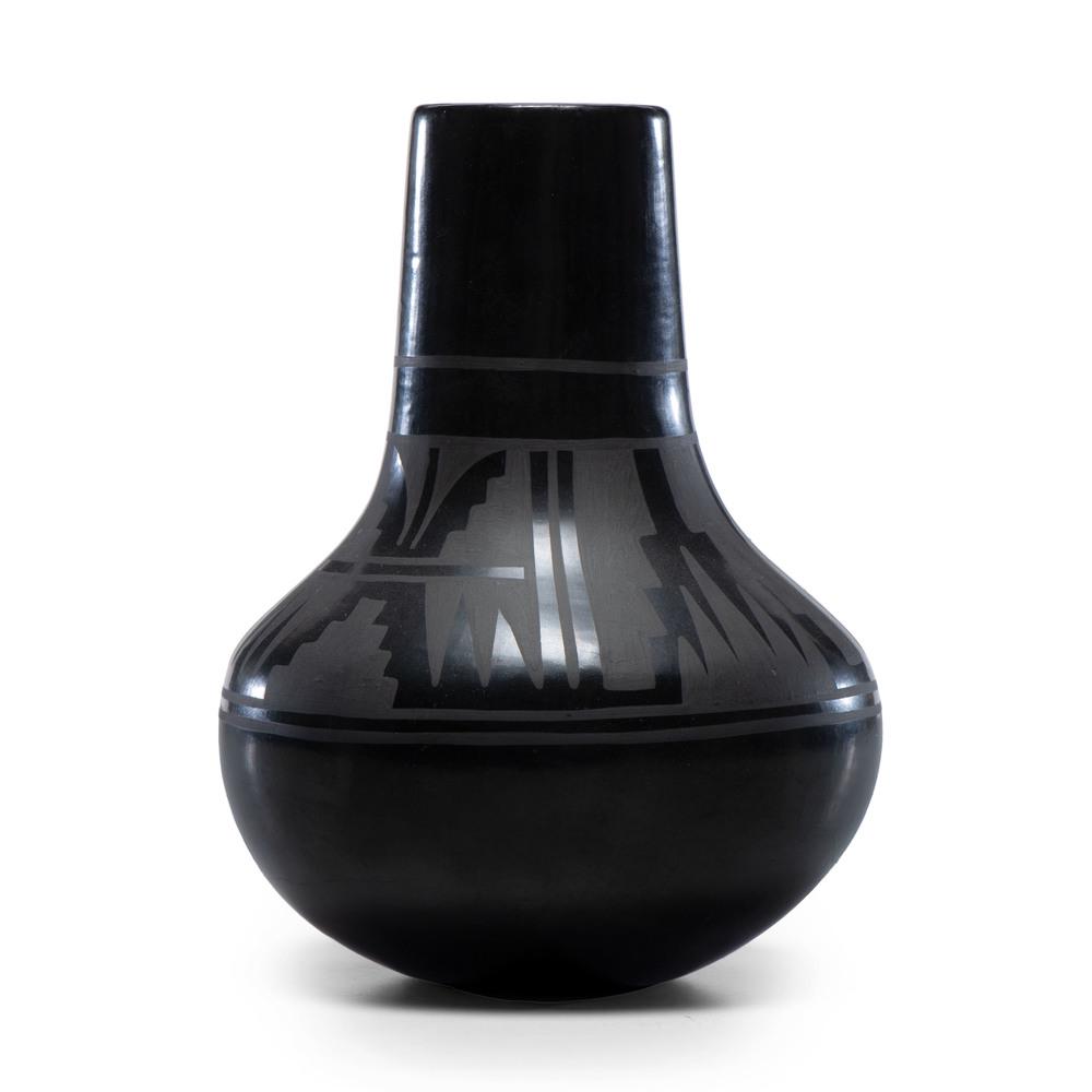 Crucita Calabaza, Blue Corn (San Ildefonso, 1921-1999): Crucita Calabaza, Blue Corn (San Ildefonso, 1921-1999) Blackware Pottery Vase, Property of the National Museum of Women in the Arts, Washington, D.C. long cylindrical neck, wide body, banded geometric