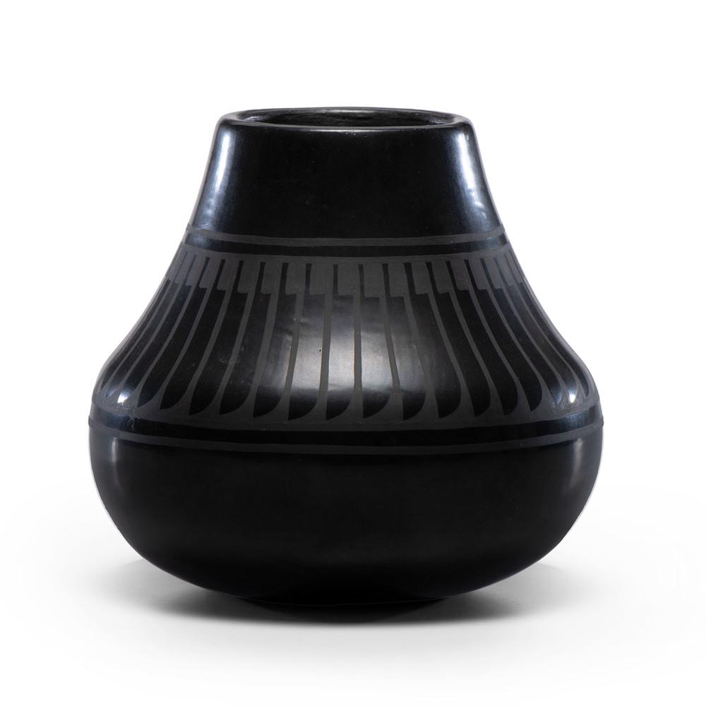 Crucita Calabaza, Blue Corn (San Ildefonso, 1921-1999): Crucita Calabaza, Blue Corn (San Ildefonso, 1921-1999) Blackware Pottery Jar, Property of the National Museum of Women in the Arts, Washington, D.C. having steeply sloped sides and an elongated neck;