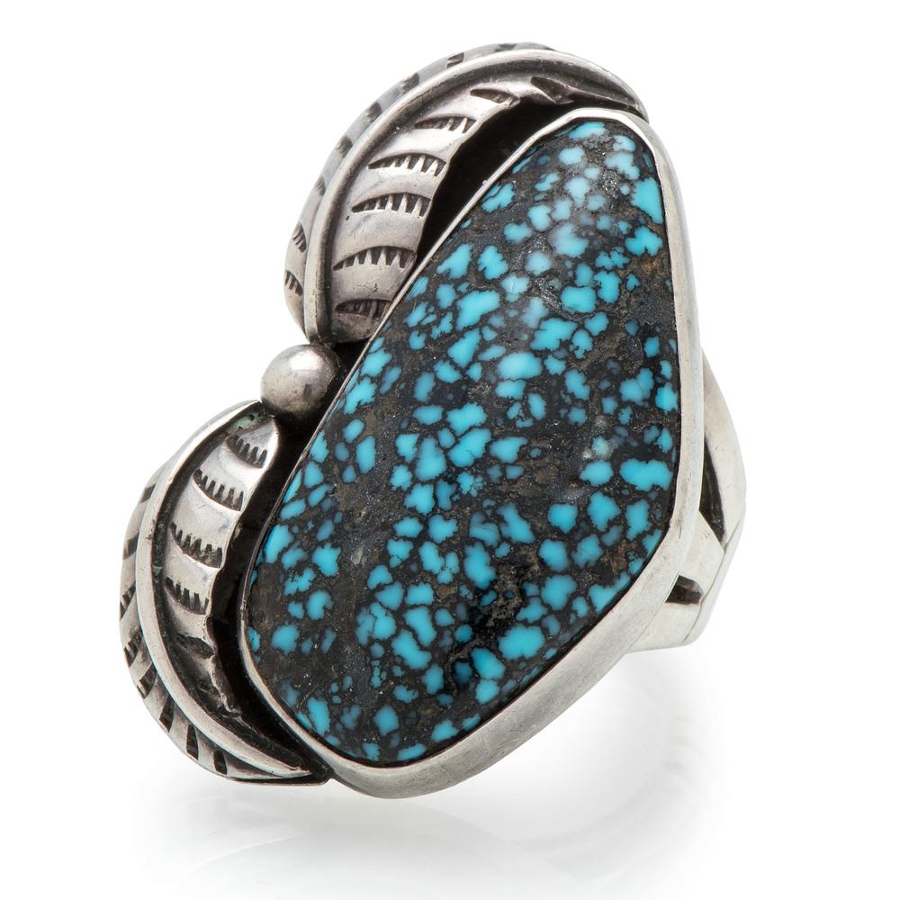 Preston Monongye (Hopi, 1927-1987) Silver and Lander: Preston Monongye (Hopi, 1927-1987) Silver and Lander Turquoise Ring with an organic shaped Lander turquoise cabochon with silver applique leaves set off to the side; marked with the thunderbird hallma