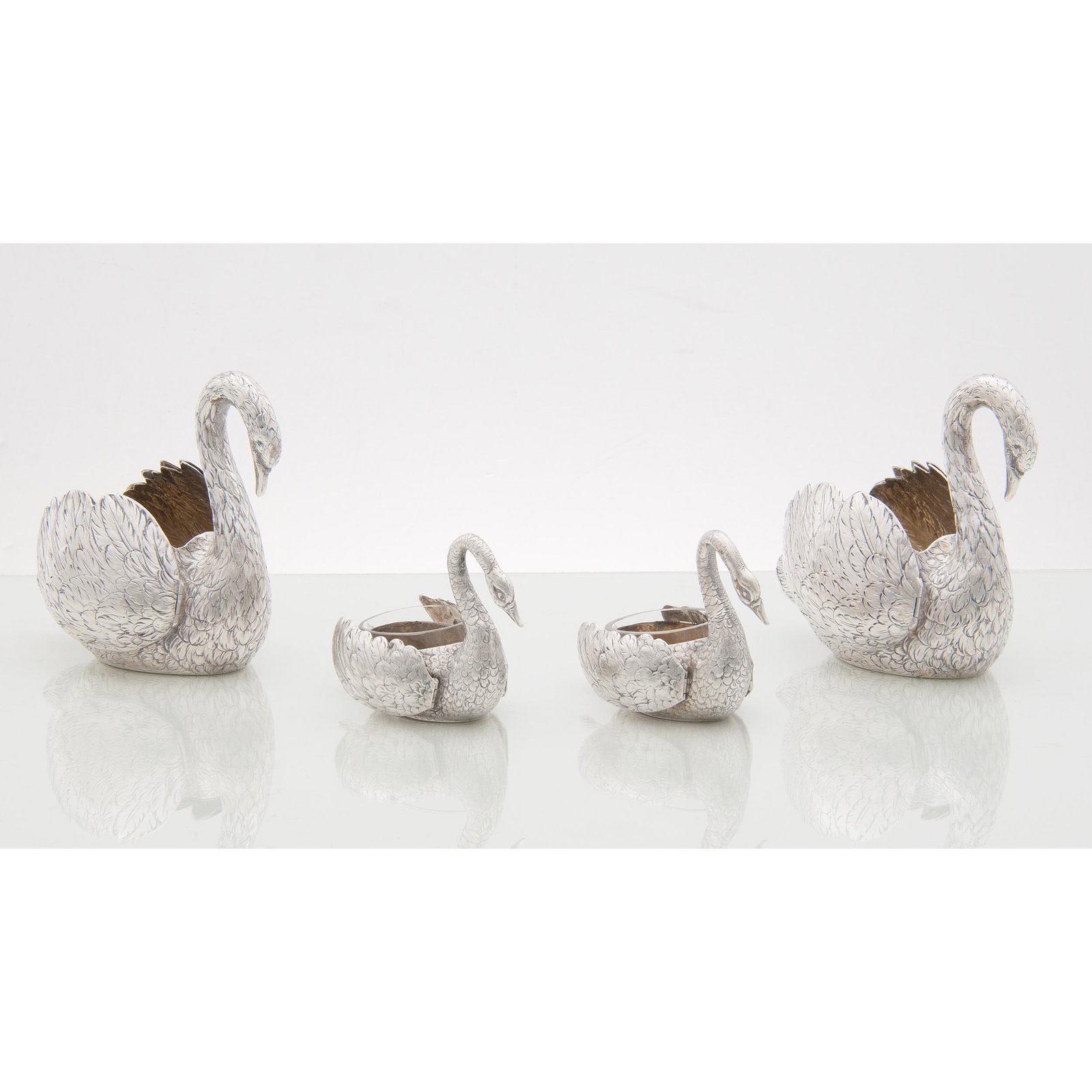 German 800 Silver Swan Figural Sugars and Salts: German 800 Silver Swan Figural Sugars and Salts German, late 19th-early 20th century. A set of four 800 silver figural vessels in the forms of swans with hinged wings, including two sugars and two sal