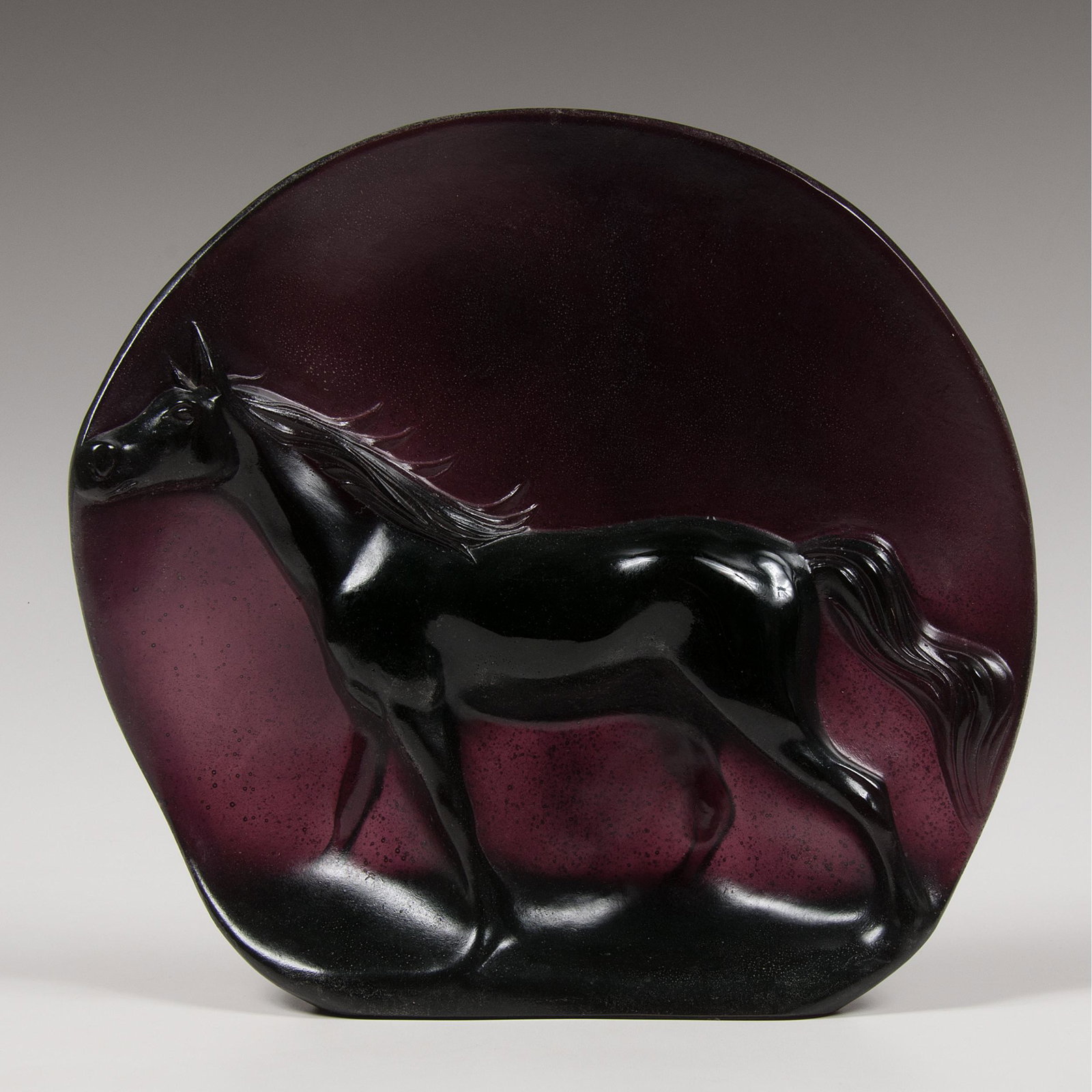 Guy Petitfils (French, 20th Century) Daum Pâte de Verre: Guy Petitfils (French, 20th Century) Daum Pâte de Verre Horse French, 20th century. A molded glass figure of a horse in relief in amethyst colored glass, marked on verso DAUM 144/150; Guy Petitfils;