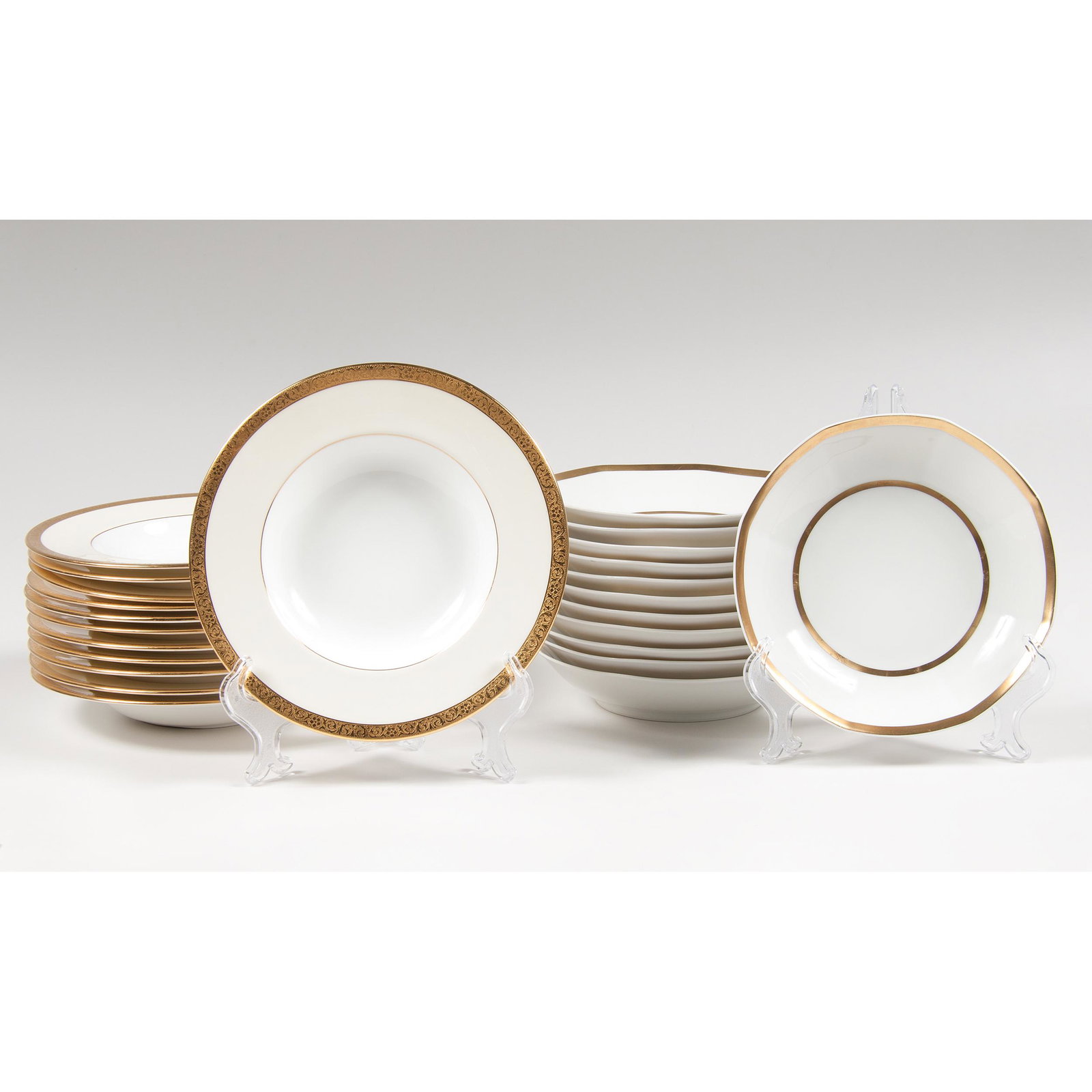 Gold-Rimmed Tressemann & Vogt Limoges and Minton: Gold-Rimmed Tressemann & Vogt Limoges and Minton Porcelain Bowls French and British, early 20th century. An assembled group of twenty-four gold-rimmed porcelain bowls, including twelve octagonal-rimme