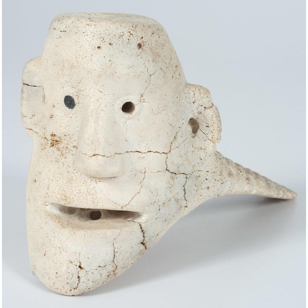 Inuit Carving of Sedna: Inuit Carving of Sedna whale bone carving with baleen eyes, one eye is missing, depicting Sedna, Inuit goddess of the sea and marine animals; signed in syllabics on base, height 5.5 in. x length 8.75