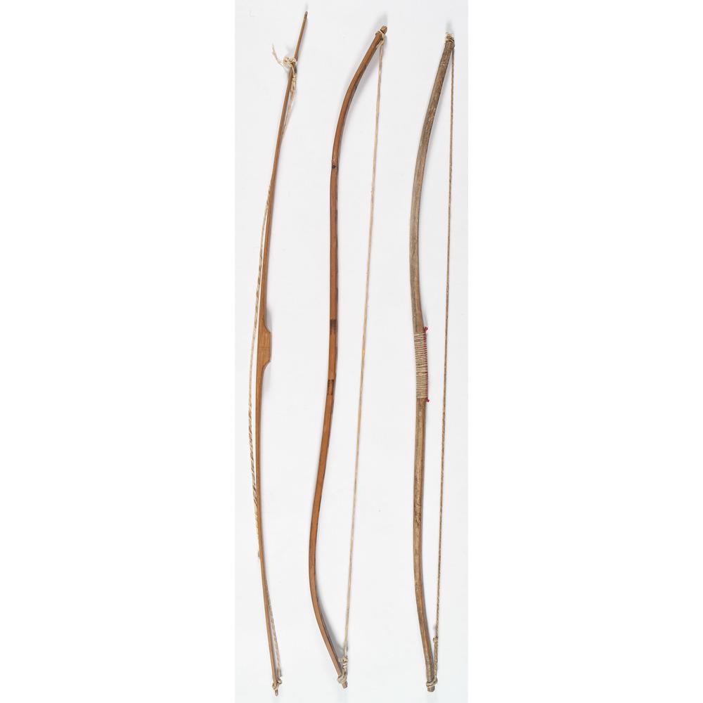 Group of Wood Bows: lot of 3, includes a sinew-backed Sioux wood bow; length 42 in.; PLUS a Cree wood bow, length 43.75 in.; And a contemporary wood bow, length 42.25 in. 20th century Provenance: Deaccessioned from th
