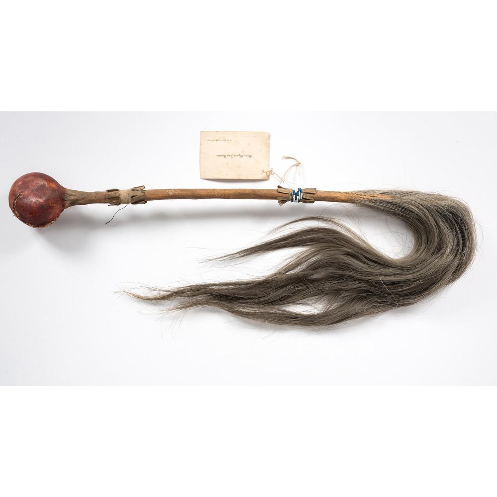 Plains Painted Stone Club: stone head covered in hide and painted with red pigment; gray horsehair, overall length 38 in., club length 17 in. late 19th century Included is a calling card from Mrs. Myron Day Downs with "descri