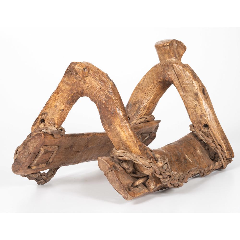 Plains Wooden Saddle Tree: wood with heavy polish; braided rawhide roping, length 15 in. x width 10 in. second half 19th century