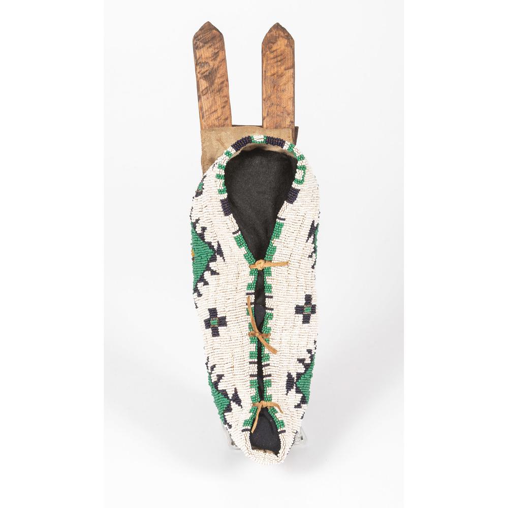 Reproduction Northern Plains Toy Cradle: thread-sewn and beaded on thick cloth and decorated with colors of white, green, and navy blue, length 13.5 in. mid-20th century
