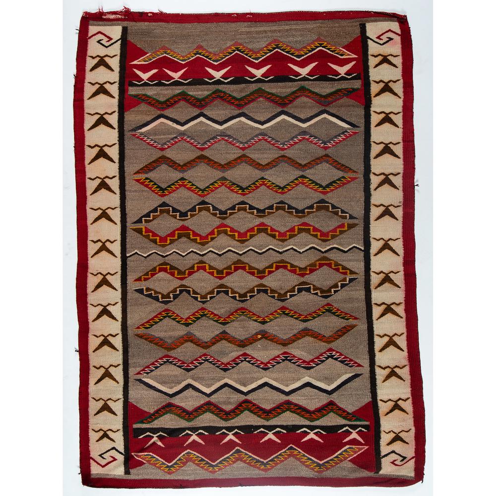 Navajo Regional Weaving / Rug: hand-spun wool in colors of red, grey, cream, black, orange, yellow, blue, and dark green; details of commercial wool in emerald green, 64 x 46 in. second quarter 20th century