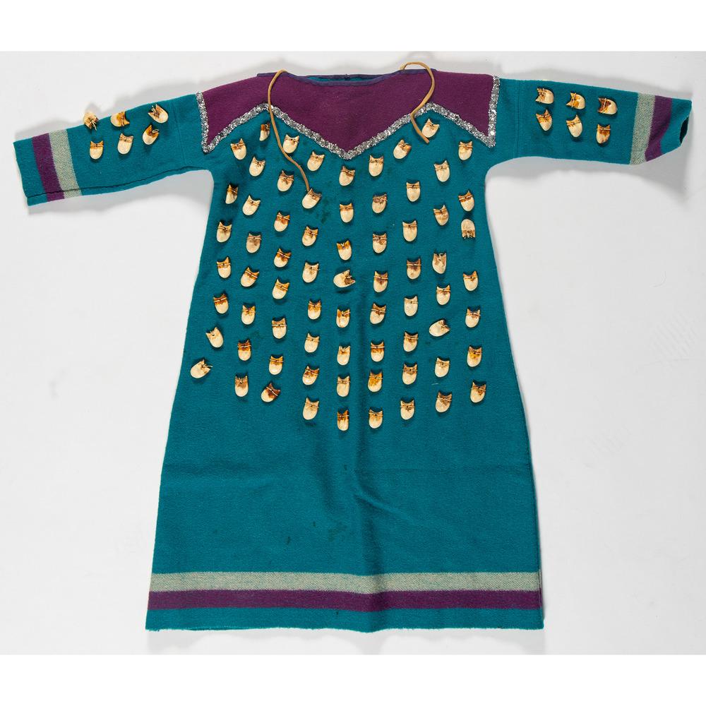 Apsaalooke (Crow) Girl's Dress: thick bright blue wool dress, purple and grey details, silver sequin decorations, imitation elk teeth made from resin; length 30 in. x chest 15.5 in. second half 20th century