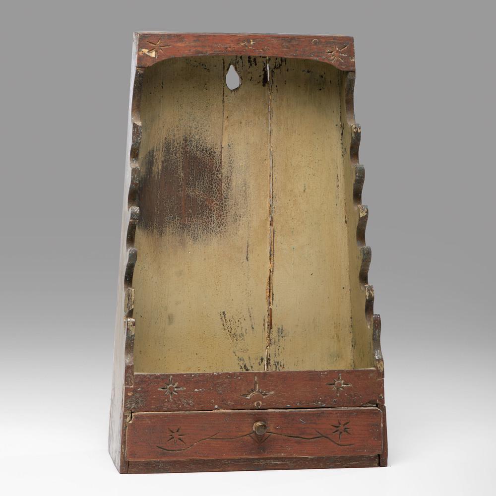 A Painted and Carved Pine Hanging Pipe Rack: A Painted and Carved Pine Hanging Pipe Rack Late 18th/Early 19th Century Height 19 x width 11 x depth 5 inches. Property from the Collection of Judith & Gary Gay, Morrow, Ohio