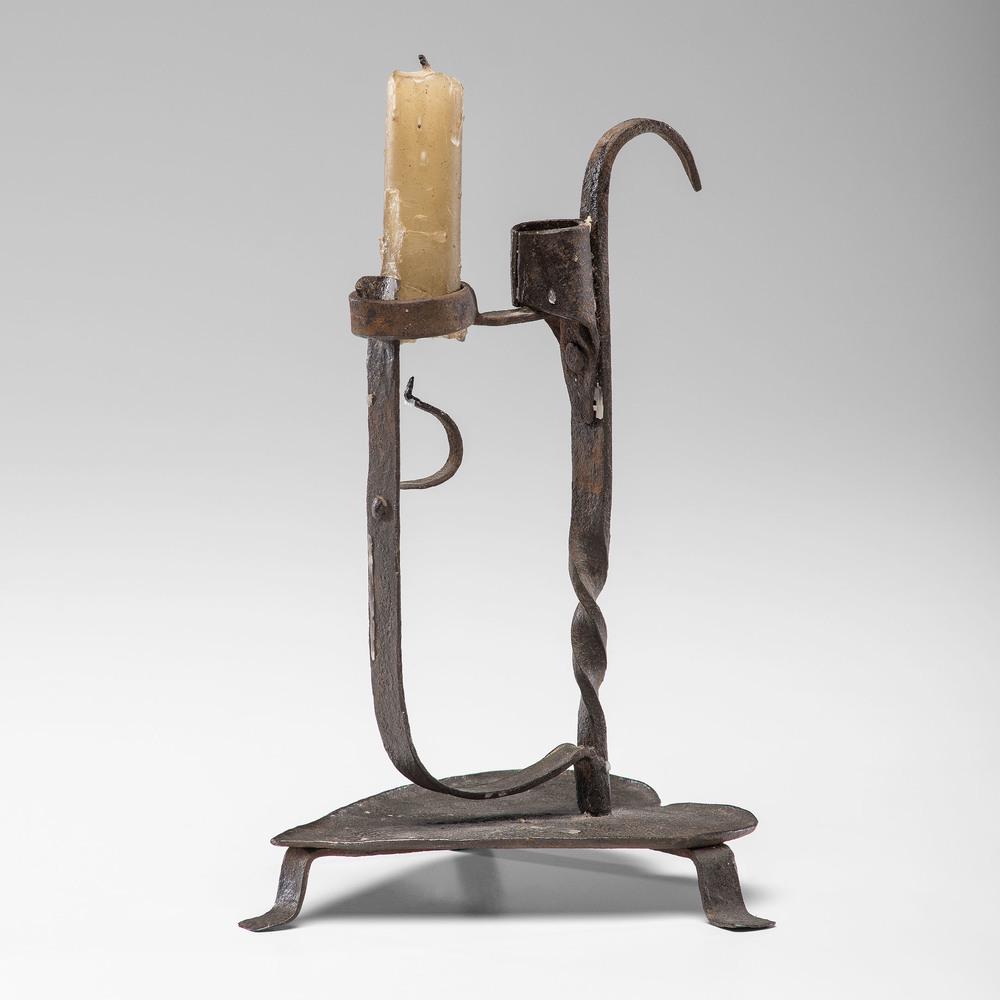 A Wrought Iron Rush Light: A Wrought Iron Rush Light 18th Century on a heart-shaped base. Height 8 1/2 inches. Property from the Collection of Judith & Gary Gay, Morrow, Ohio