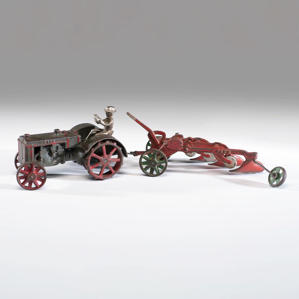 A Vindex Cast Iron Case Plow and Tractor: A Vindex Cast Iron Case Plow and Tractor Overall length 19 inches.