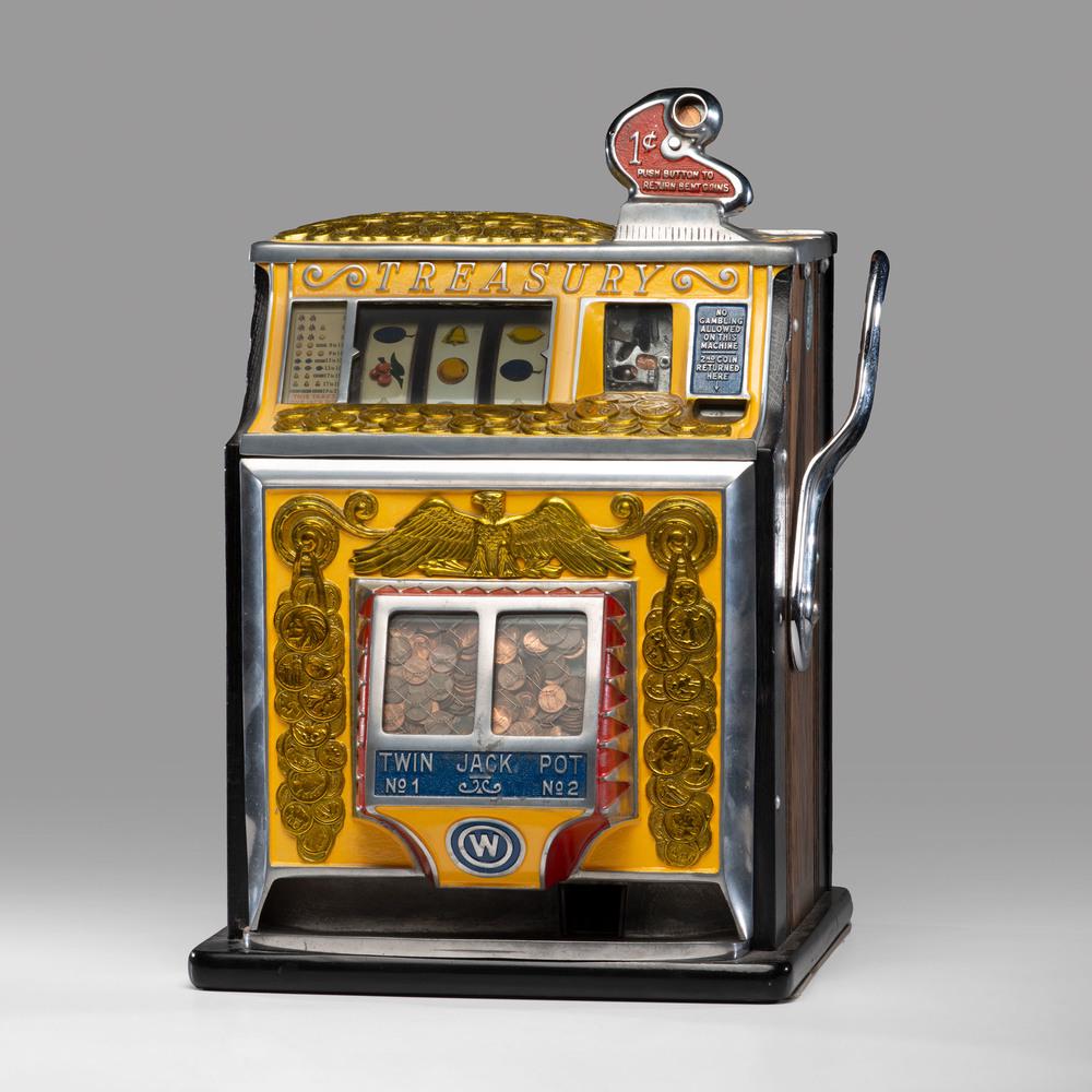 A Watling 1¢ Treasury Twin Jackpot Slot Machine: A Watling 1¢ Treasury Twin Jackpot Slot Machine Circa 1930s Height 23 x width 16 x depth 15 inches.