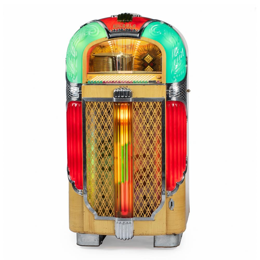 A Rock-Ola, Model 1428 Magic Glo Jukebox: A Rock-Ola, Model 1428 Magic Glo Jukebox Circa 1948 Height 60 x width 32 x depth 26 inches.