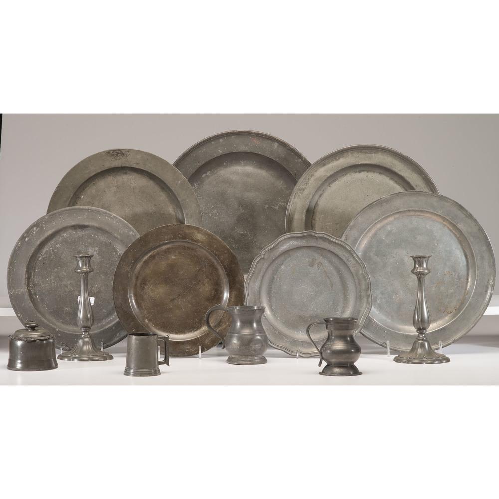 A Group of Pewter Table Wares: A Group of Pewter Table Wares English and Continental, 19th Century including seven chargers, three tankards, a pair of candlesticks and a tobacco jar. Diameter of largest charger 16 3/4 inches.