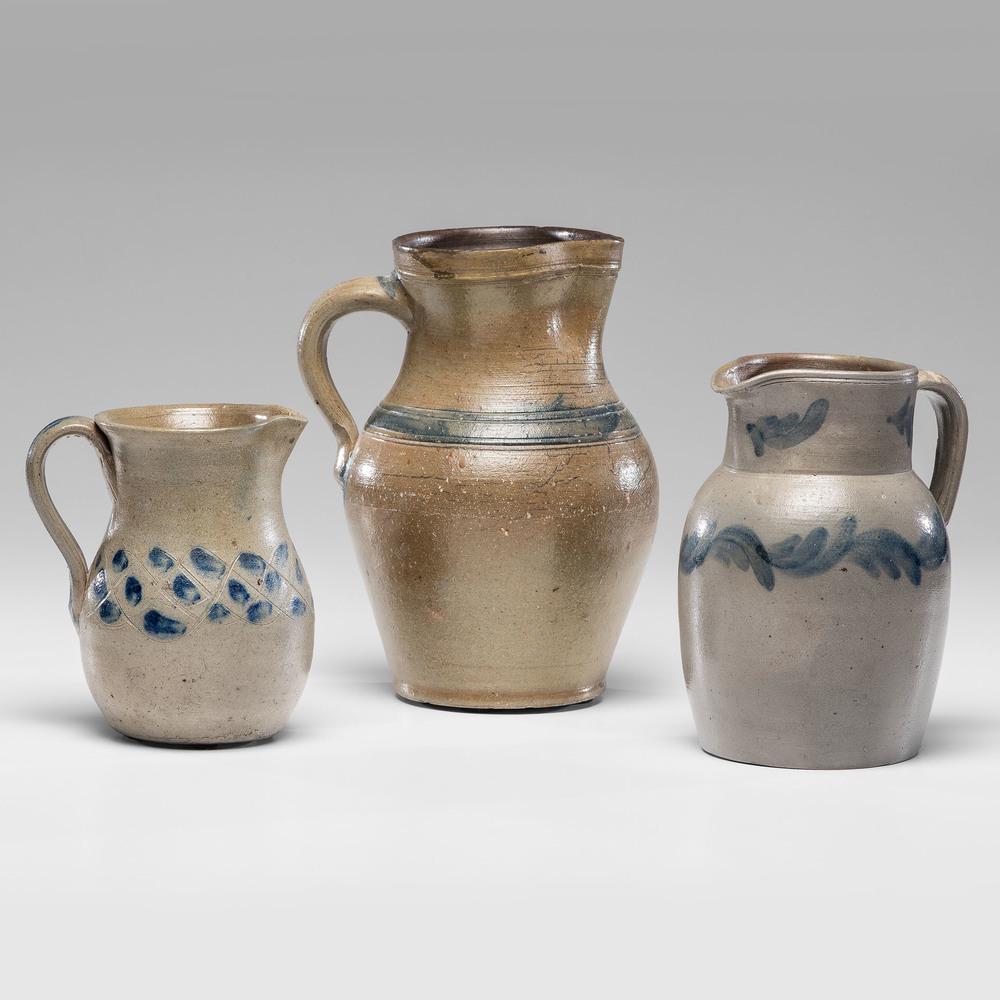 Three Cobalt-Decorated and Incised Stoneware Pitchers: Three Cobalt-Decorated and Incised Stoneware Pitchers 19th Century Height of largest 10 3/4 inches. Provenance: Property from the Collection of Judith & Gary Gay, Morrow, Ohio