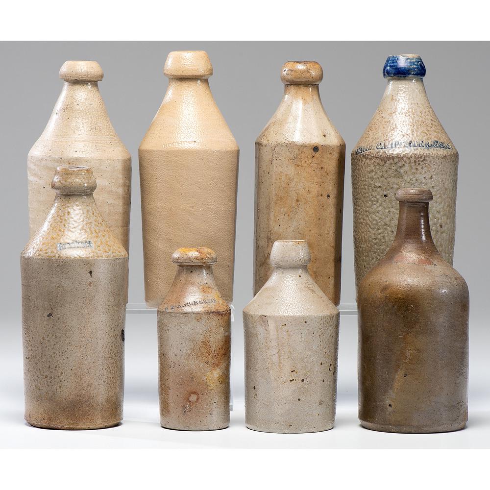 Eight Stoneware Bottles: Eight Stoneware Bottles 19th Century including four bottles marked by Brackstt, Rochester, W.P. Knickerbocker and Earl Carpenter & Son. Height of largest 10 inches. Provenance: Property from the