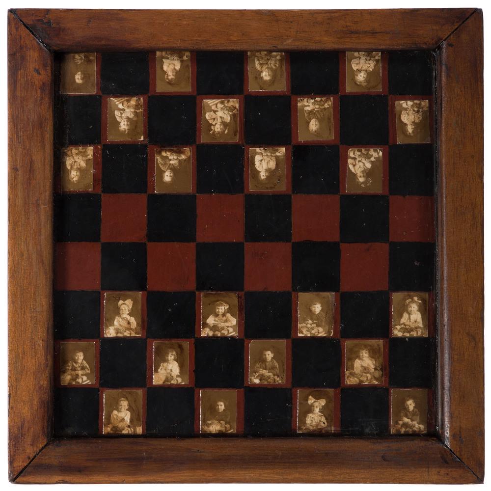 A Folk Art Photo-Decorated Game Board: A Folk Art Photo-Decorated Game Board Late 19th/Early 20th Century set with photos of children, possibly a school group. 15 x 15 inches.