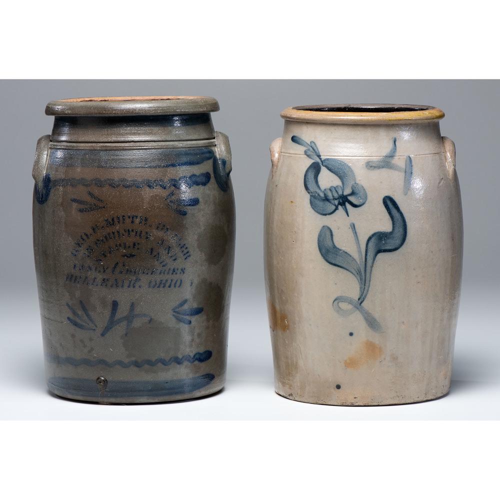 Two Cobalt-Decorated Four-Gallon Crocks: Two Cobalt-Decorated Four-Gallon Crocks 19th Century one with partially obscured stenciled grocer's label from Bellaire, Ohio. Height of largest 15 x width 10 inches. Provenance: Property from the Col