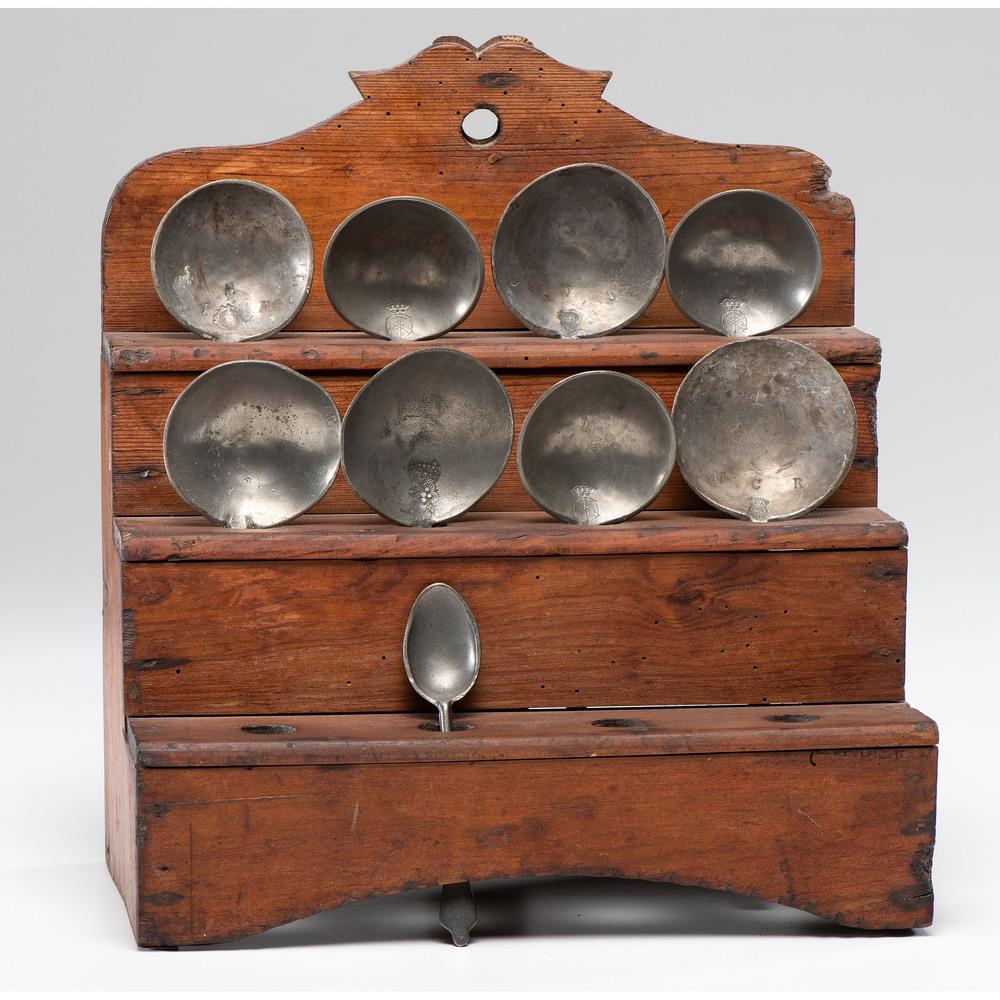 A Country Hanging Pine Spoon Rack: A Country Hanging Pine Spoon Rack 19th Century including nine pewter spoons. Height 12 x width 11 x depth 7 inches. Provenance: Property from the Collection of Judith & Gary Gay, Morrow, Ohio