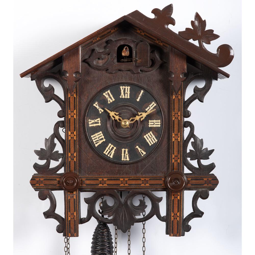 Two German Carved Clocks: Two German Carved Clocks 20th Century Height of larger 18 1/4 inches.