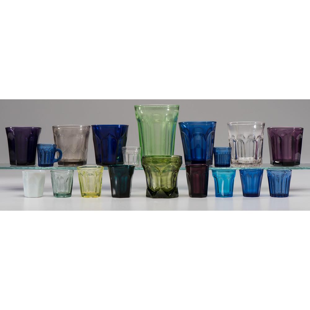A Group of Molded and Blown Colored Glass Cups: A Group of Molded and Blown Colored Glass Cups 19th/20th Century nineteen total, colors include cobalt, olive, amethyst, emerald, turquoise, and uranium (vaseline). Height of largest 5 1/2 inches.