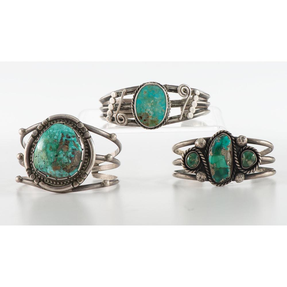 Navajo Silver and Turquoise Cuff Bracelets: lot of 3, includes a silver wire cuff accented with silver appliqued beads and set with a singular turquoise cabochon; not marked, cuff width 1.75 in., interior circumference 5.5 in. x gap length 0.75