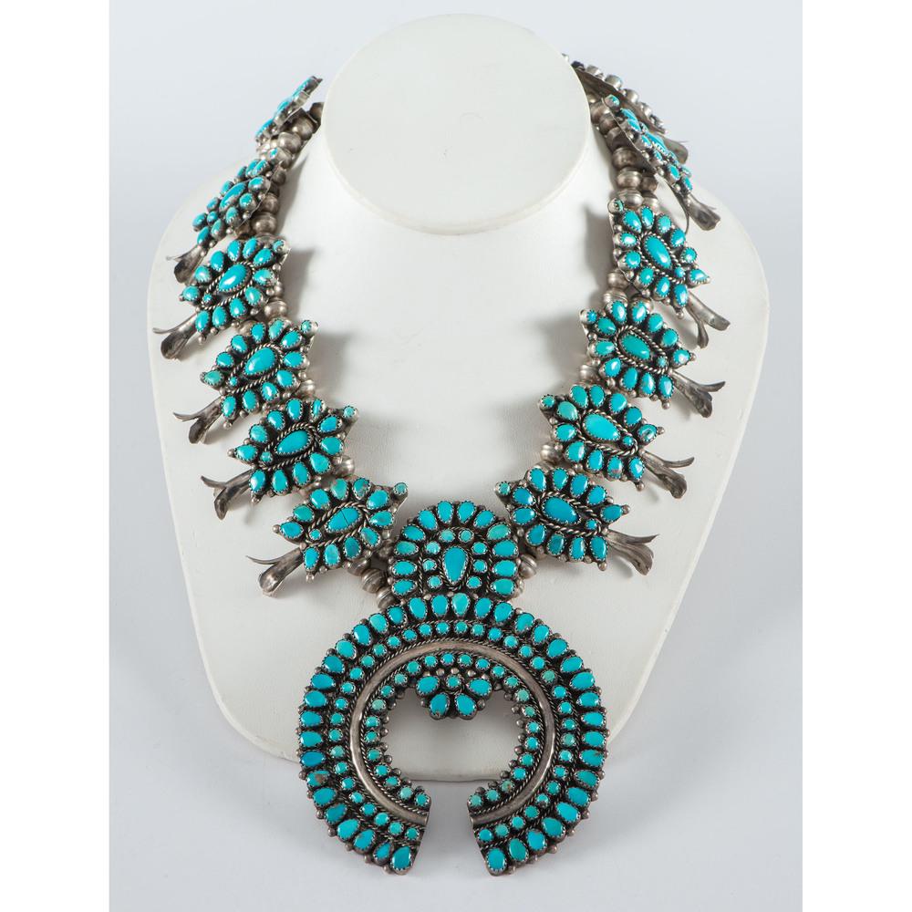 Victor Moses Begay (Dine, 20th century) Navajo Silver: Victor Moses Begay (Dine, 20th century) Navajo Silver and Turquoise Squash Blossom Necklace twelve silver squash blossoms set with petit point surround matching naja; marked V.M.B. on back of naja, le