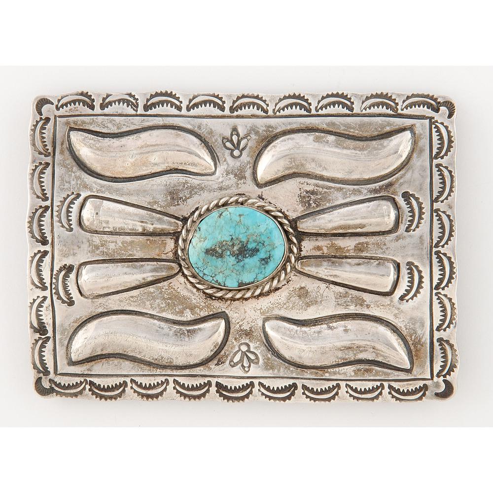 McBride Lomayestewa (Hopi, 1632-2002) Silver and: McBride Lomayestewa (Hopi, 1632-2002) Silver and Turquoise Ketoh Concha with stamped edges and repousse radiating from central turquoise stone; marked with lightning bolt hallmark and Hopi guild hallm