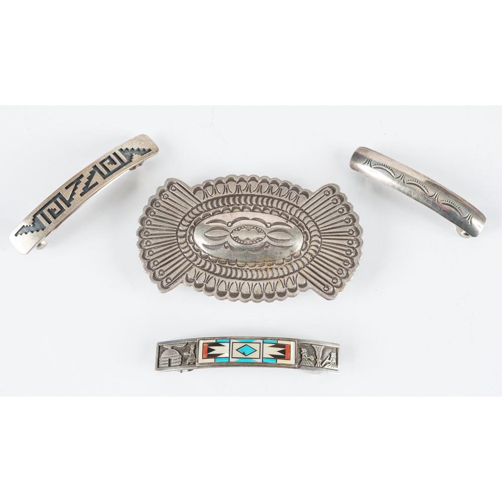 Navajo and Hopi Silver Barrettes: lot of 4, includes a large, heavily stamped, silver barrette with scalloped edges; marked TC, length 3.75 in. x width 2.25 in., weight 31.0 dwt.; PLUS a slender and simple, stamped silver barrette; no