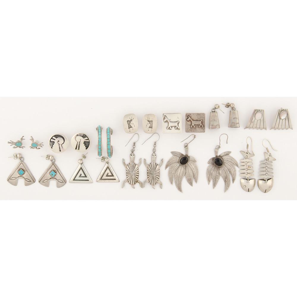 An Assortment of Navajo, Zuni, Hopi, and Mexican Silver: An Assortment of Navajo, Zuni, Hopi, and Mexican Silver Earrings lot of 12 pairs, includes longest length 2.25 in., shortest length 0.75 in., combined weight 60.2 dwt. third quarter 20th century