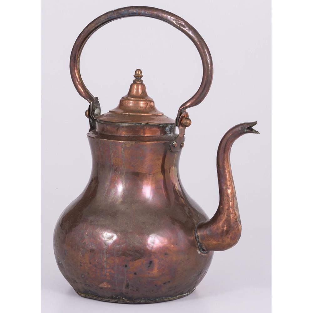 A Dutch Hammered Copper Kettle: A Dutch Hammered Copper Kettle 19th Century unmarked. Height 14 1/4 x width 12 x depth 8 inches.
