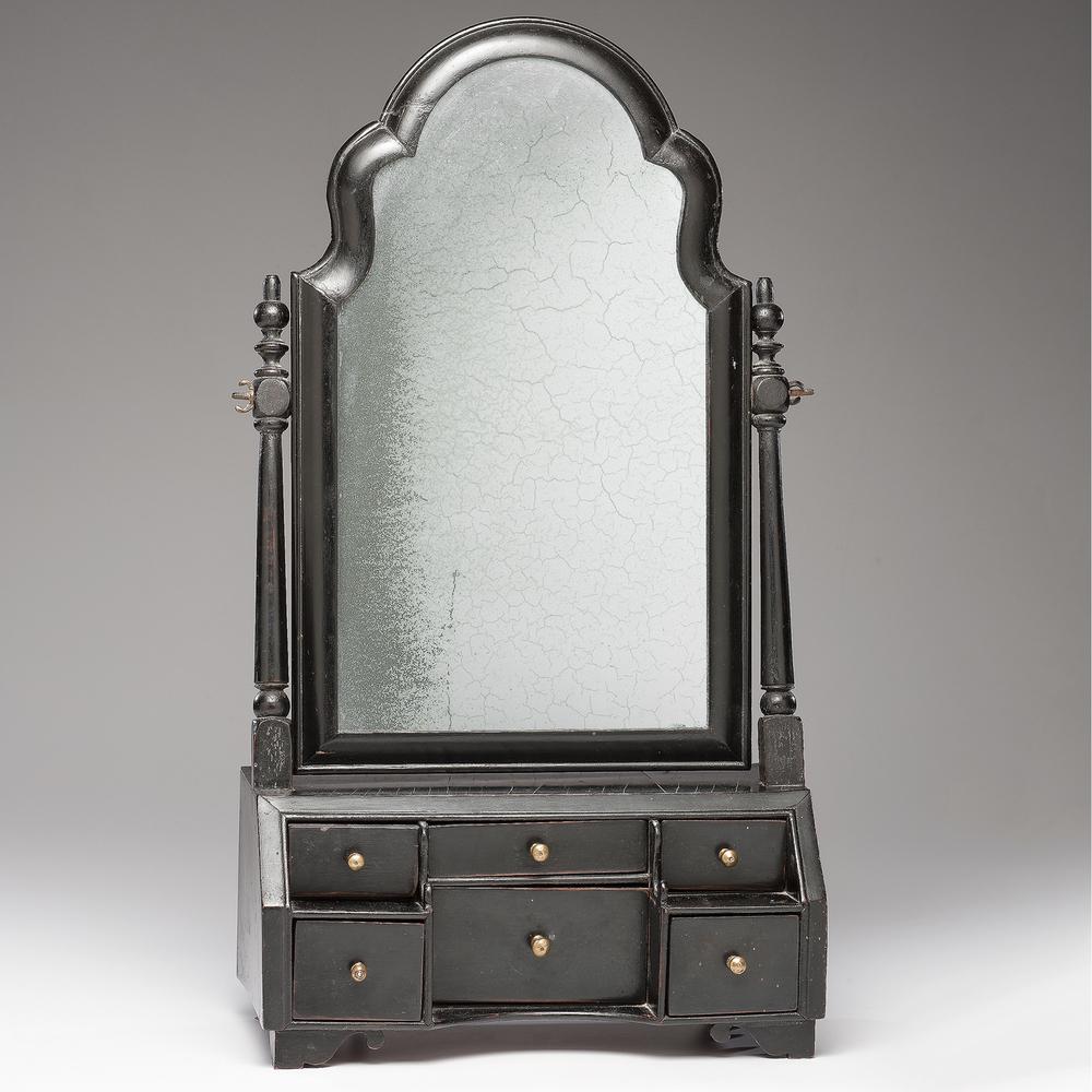 A Queen Anne Ladies Dressing Mirror: A Queen Anne Ladies Dressing Mirror English, 18th Century in ebonized wood. Height 24 1/2 x width 13 1/4 x depth 7 inches. Accompanied by letter detailing provenance.