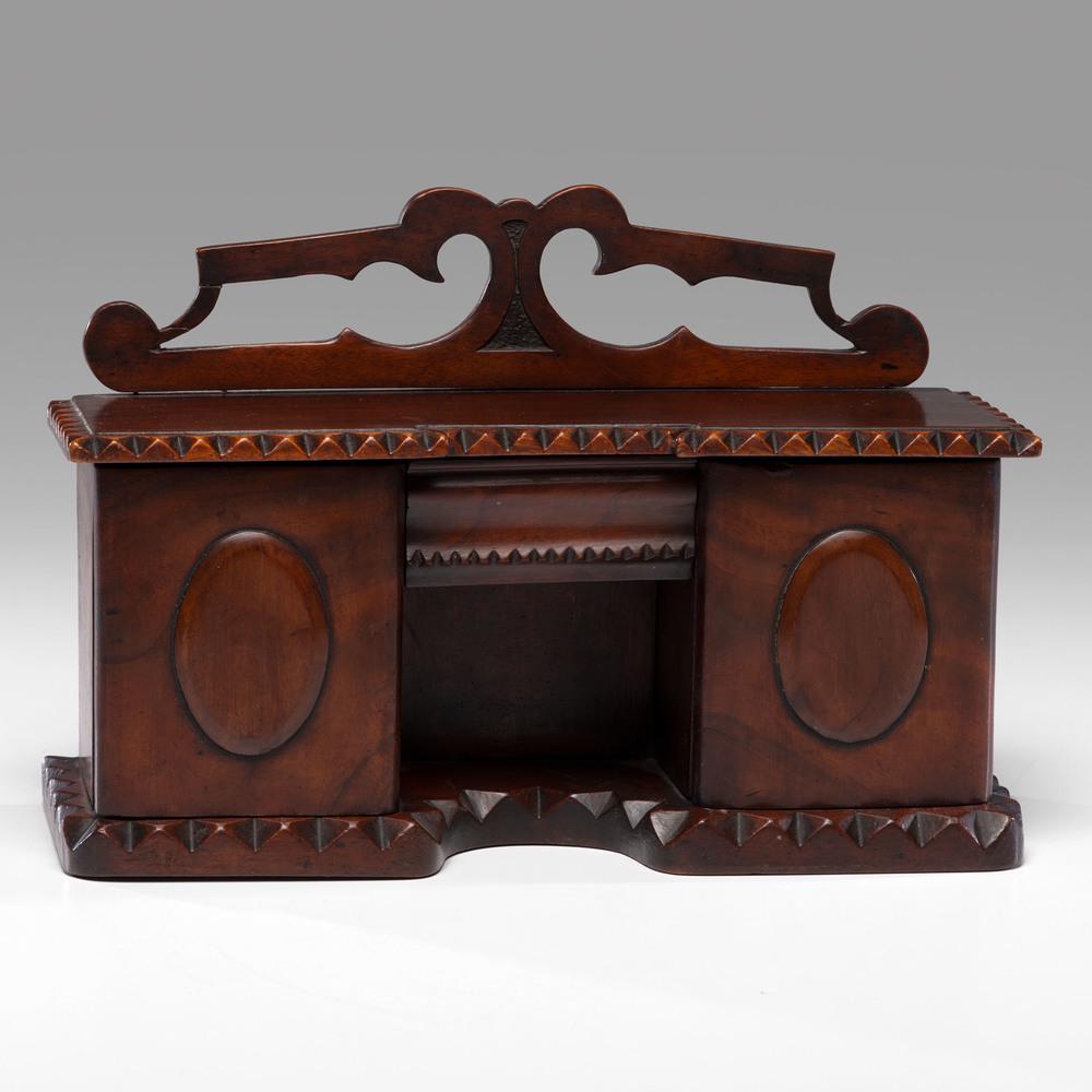 A William IV Sideboard-form Tea Caddy in Mahogany: A William IV Sideboard-form Tea Caddy in Mahogany English, early 19th Century Height 8 1/2 x width 12 3/4 x depth 4 3/4 inches.