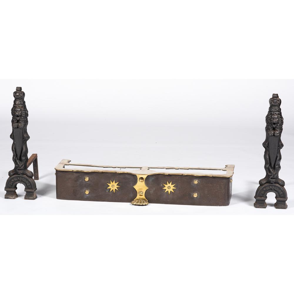 A Pair of Lion Andirons and A Brass & Iron Fender: A Pair of Lion Andirons and A Brass & Iron Fender 19th/20th Century Height of andirons 24 1/4 inches. Height of fender 6 3/4 x width 38 1/4 x depth 12 inches.