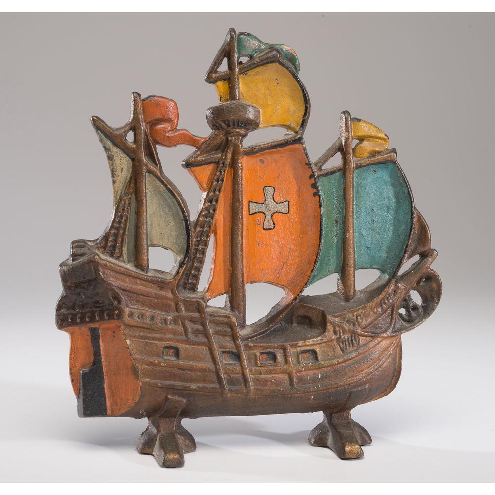 A Painted Cast Iron Ship Doorstop: A Painted Cast Iron Ship Doorstop Late 19th/Early 20th Century Height 11 3/4 inches.