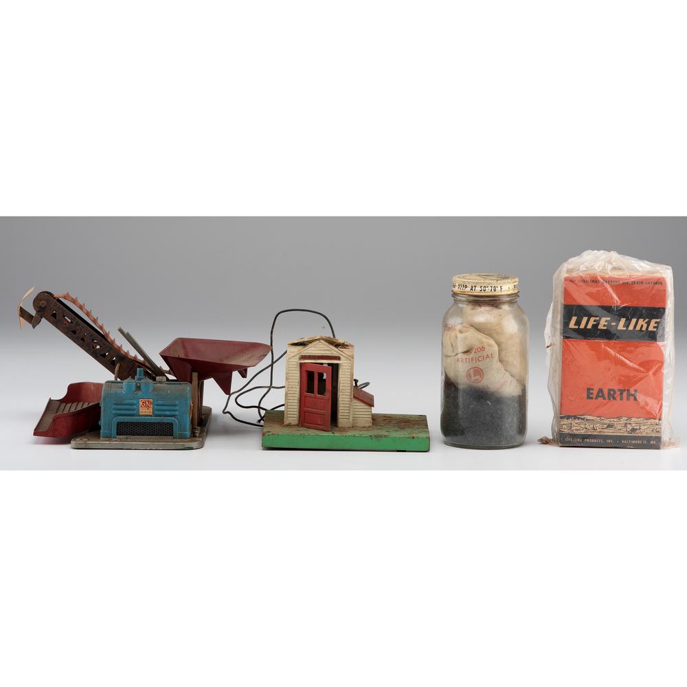A Group of Lionel and Other Train Accessories: A Group of Lionel and Other Train Accessories Lot includes Lionel 397 Coal Loader, Badger Motor Driver, Gatehouse, O-gauge track, Lionel coal (in Jar), Hobby House Grass (in a bag), Life-like Earth (