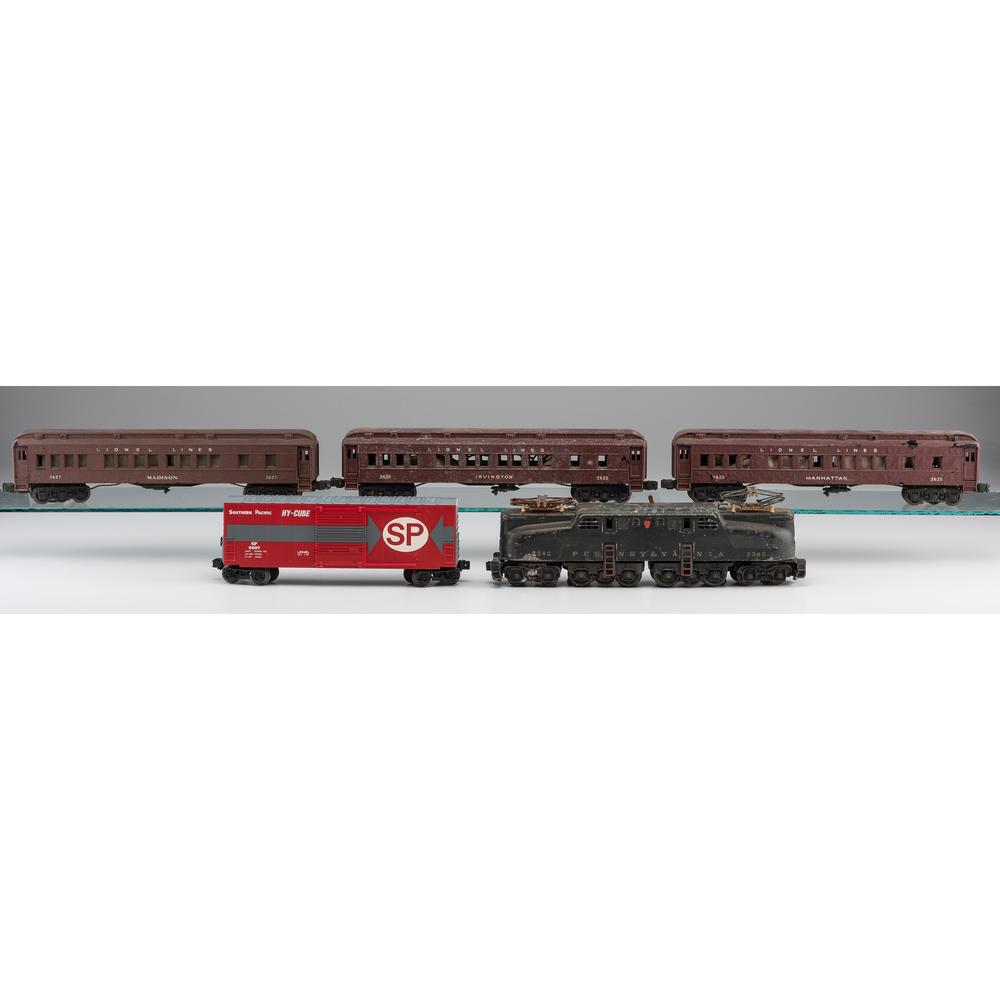 A Group of Lionel Train Cars: A Group of Lionel Train Cars Includes No. 2627 Madison Passenger Car, two No. 2625 Irvington Passenger Cars, No. 2349 Pennsylvania Engine and No. 9607 Hy-Cube Southern Pacific Car, in original boxes.