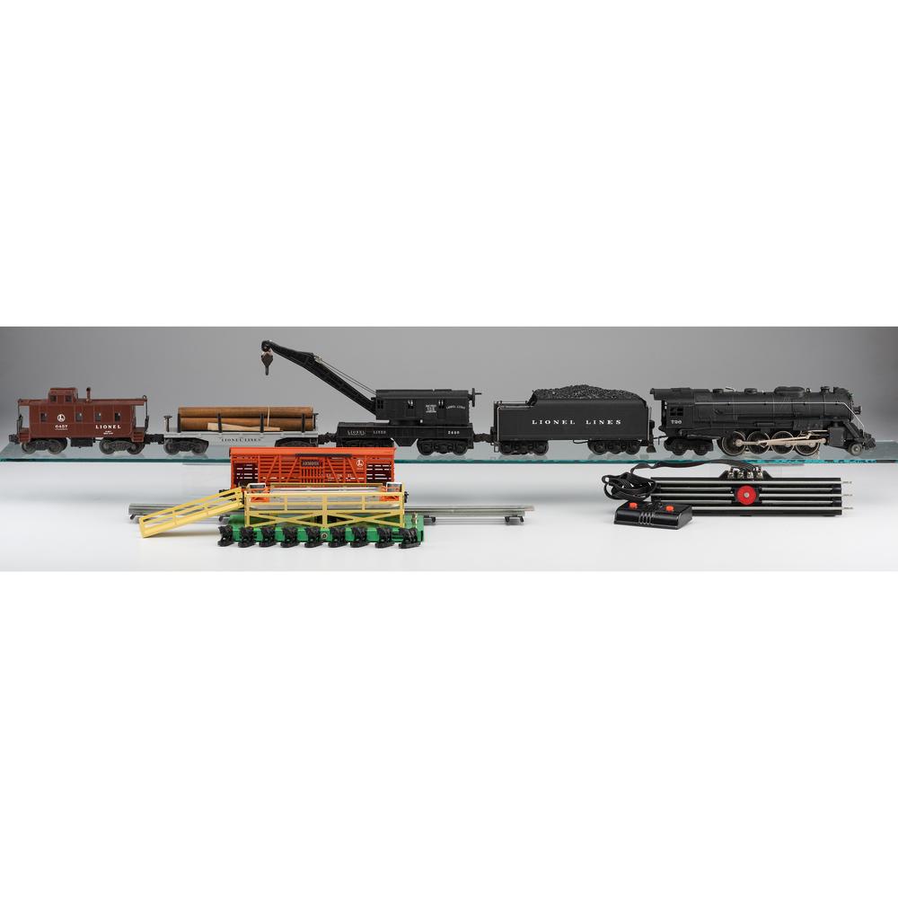 A Group of Lionel Trains and Accessories: A Group of Lionel Trains and Accessories Includes a Locomotive 726, an Operating Cattle Car No. 3656, a Tender with Whistle No. 2426W, an Operating Work Crane, No. 2460, a Caboose, No. 6457, a Flat Ca
