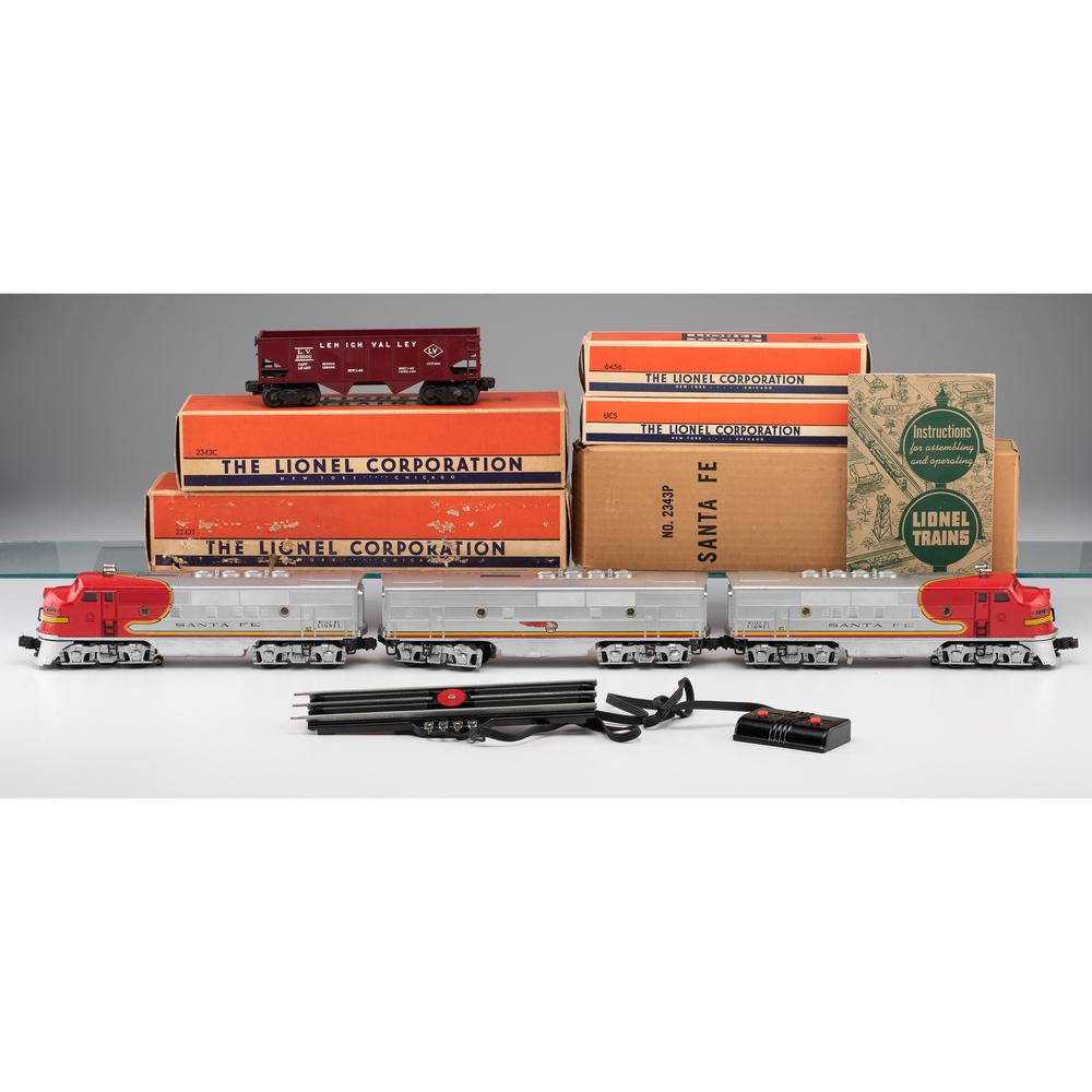 Lionel Santa Fe Trains and Tracks: Lionel Santa Fe Trains and Tracks Includes one Santa Fe 2343P, one Santa Fe 2343C "B" Unit, one Santa Fe 2343T, one "O" Gauge Remote Control Track Set and one red Hopper Car 6456, in original boxes. A