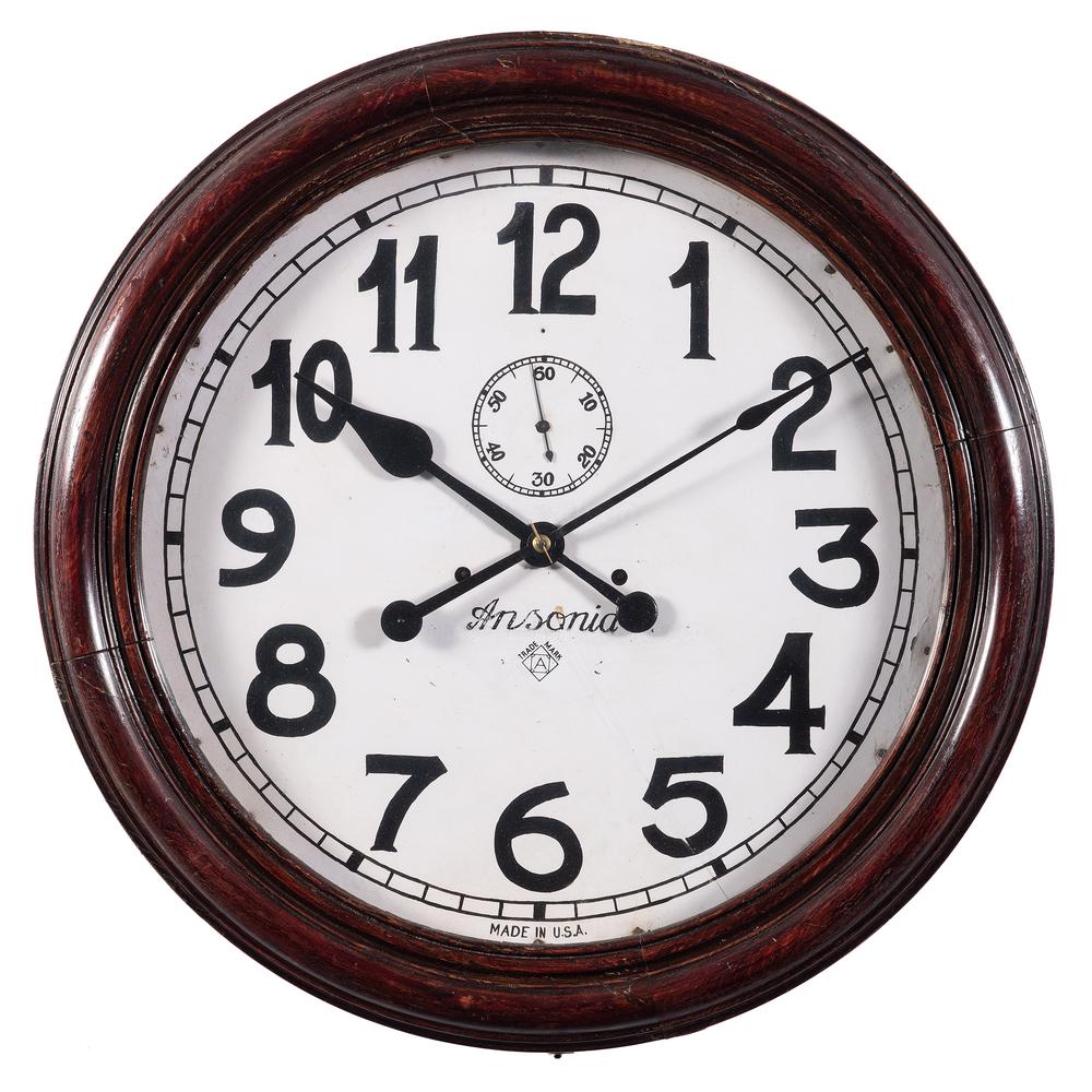 A Large Ansonia Mahogany Gallery Clock: A Large Ansonia Mahogany Gallery Clock Early 20th Century Diameter 23 inches.