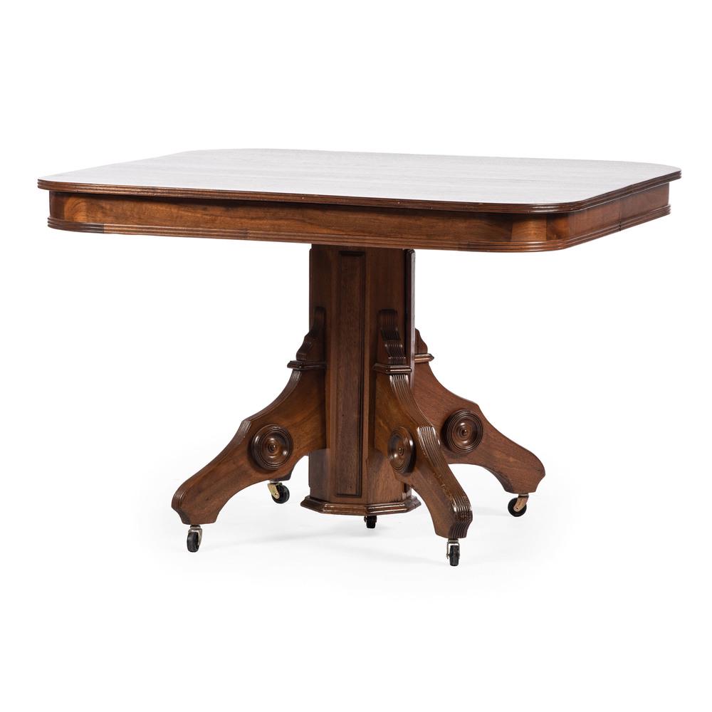A Victorian Eastlake-style Dining Table in Mahogany: A Victorian Eastlake-style Dining Table in Mahogany American, 19th Century with two leaves. Height 31 x width 45 x depth 45 1/2 inches, leaves 45 x 12 inches (each).