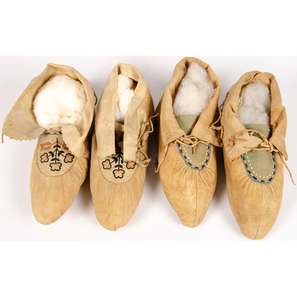 Northeastern Beaded and Embroidered Hide Moccasins: Northeastern Beaded and Embroidered Hide Moccasins lot of 2, includes one pair of Huron moccasins made with softly tanned hide and having puckered vamps and embroidered floral design, length 9.5 in.; 