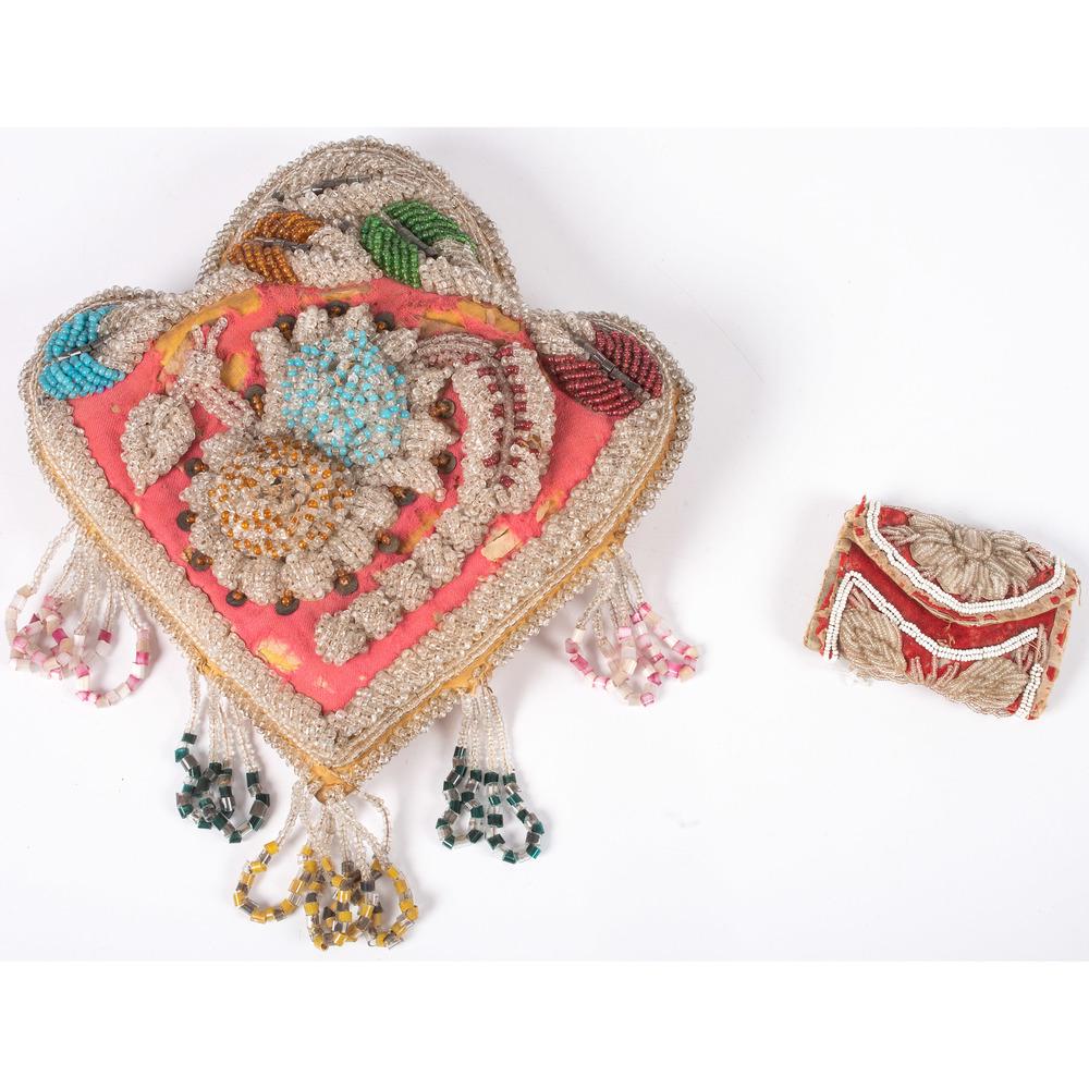 Haudenosaunee Beaded Whimsies: lot of 2, includes a spade-shaped pillow, heavily beaded with floral designs, length 10 in. x width 9.5 in.; AND a needle case or "house wife", closed width 3.25 in. x length 2.5 in. fourth quarter 1