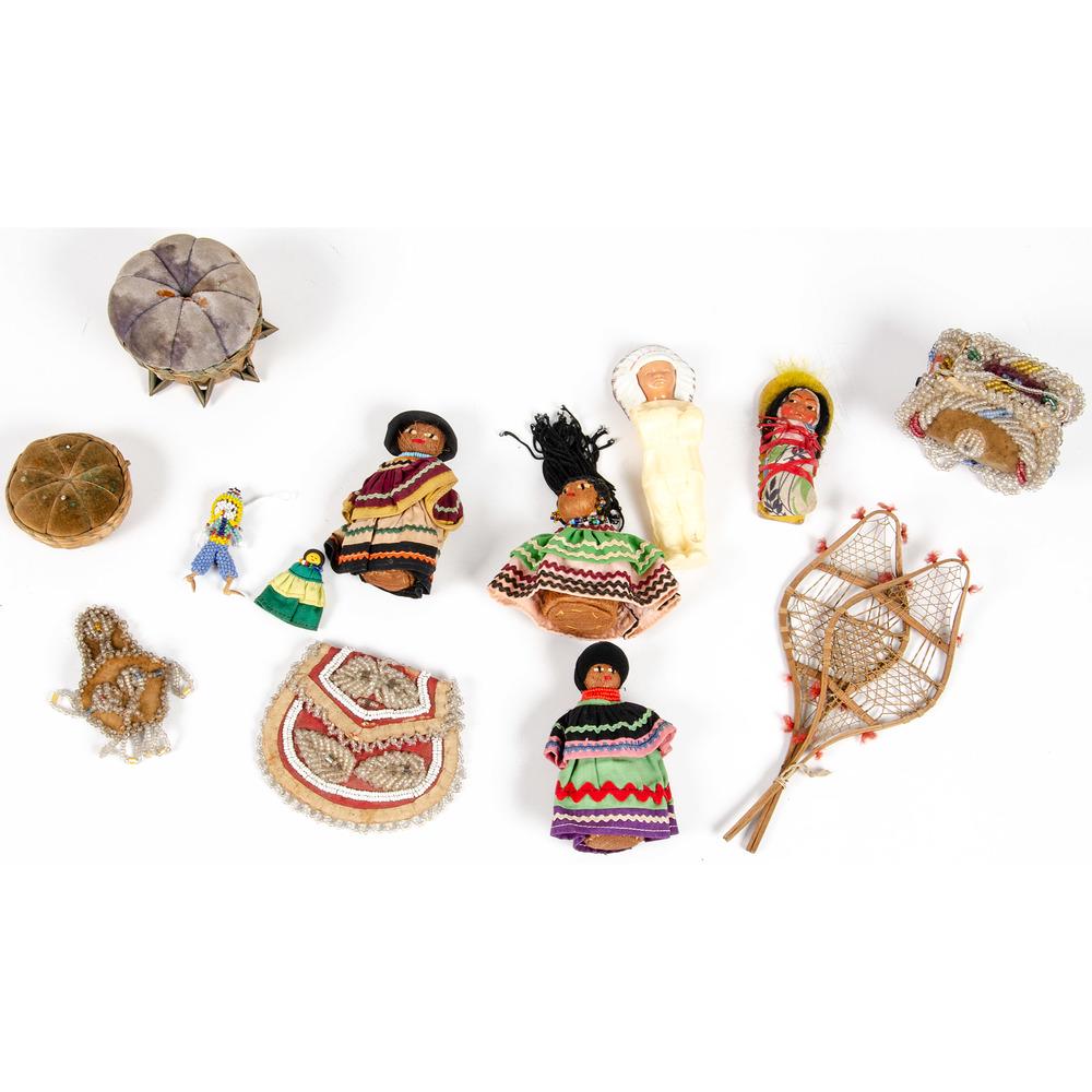 Collection of Niagara Falls Whimseys and Tamiami Trail: Collection of Niagara Falls Whimseys and Tamiami Trail Seminole Dolls lot of 14, includes a pair of miniature snowshoes, four Seminole dolls, a Skookum mailer, a beaded fetish doll, a plastic toy, pin