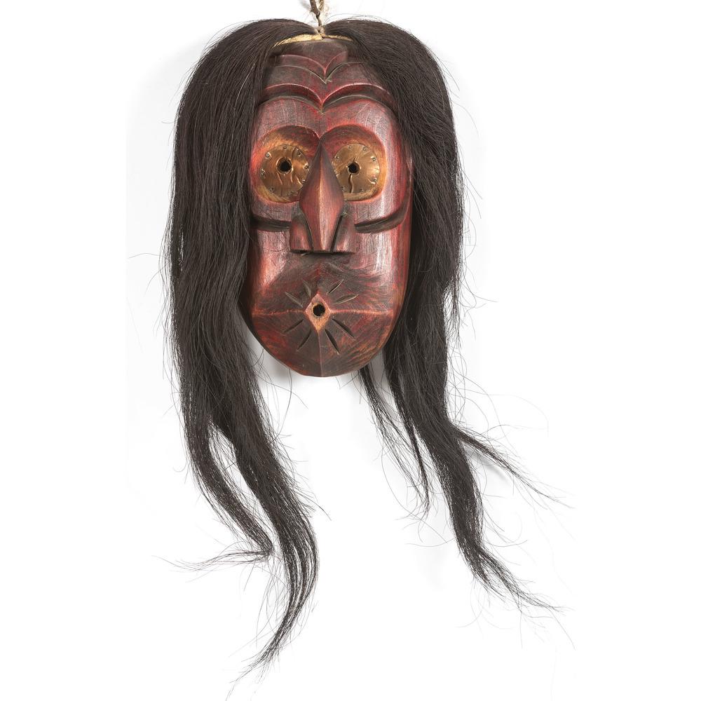 Haudenosaunee Carved Wood "Whistler" Mask: Haudenosaunee Carved Wood "Whistler" Mask painted red and black horsehair; interior with label "Hand Made/ An American Indian Treasure/ Tribe: Onondaga"; serial number stamped along right side of mas