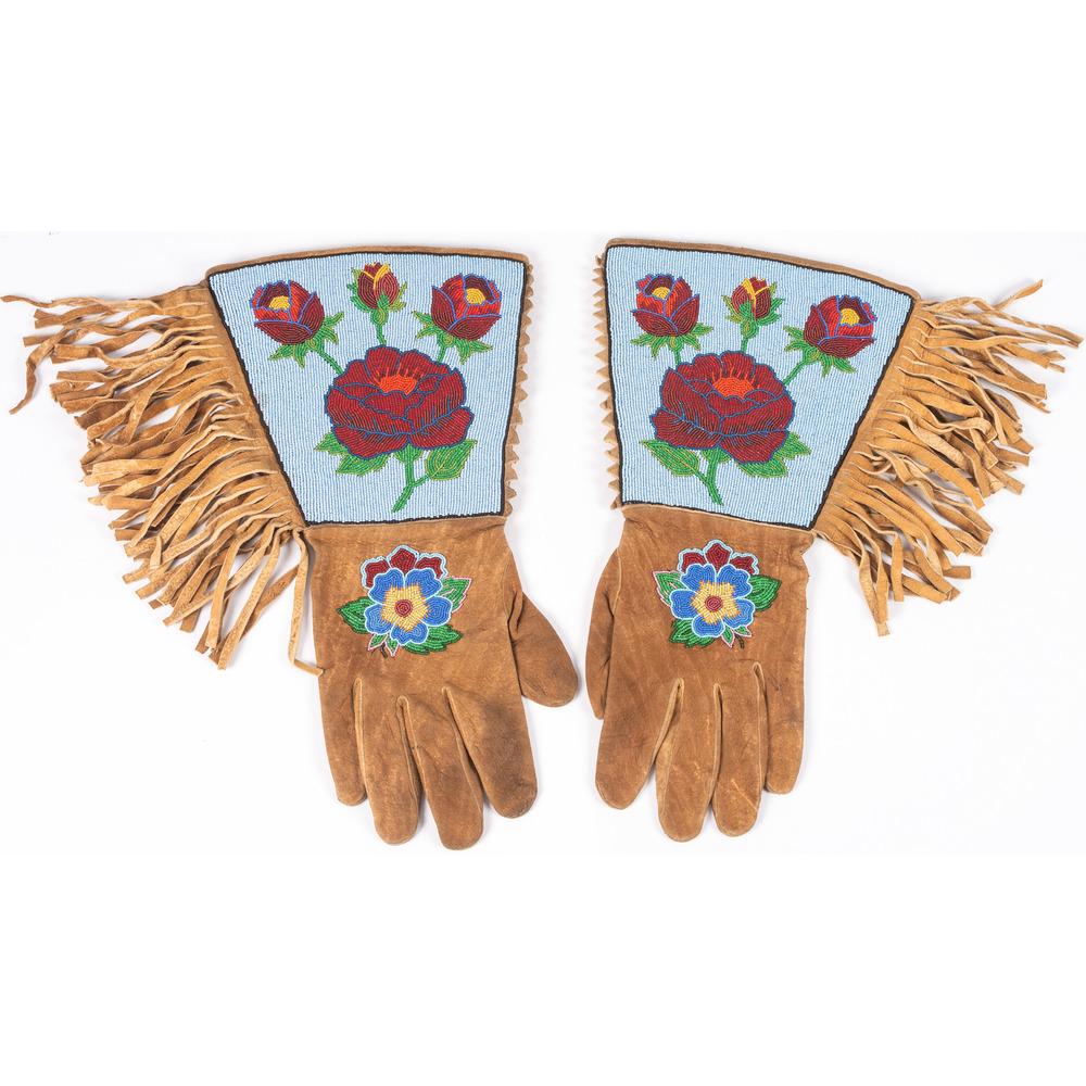 Apsaalooke [Crow] Man's Fully Beaded Gauntlets, From: Apsaalooke [Crow] Man's Fully Beaded Gauntlets, From the Stanley B. Slocum Collection, Minnesota thread-sewn and fully beaded on smoked deerhide using colors of red, blue, light blue, pea green, greas