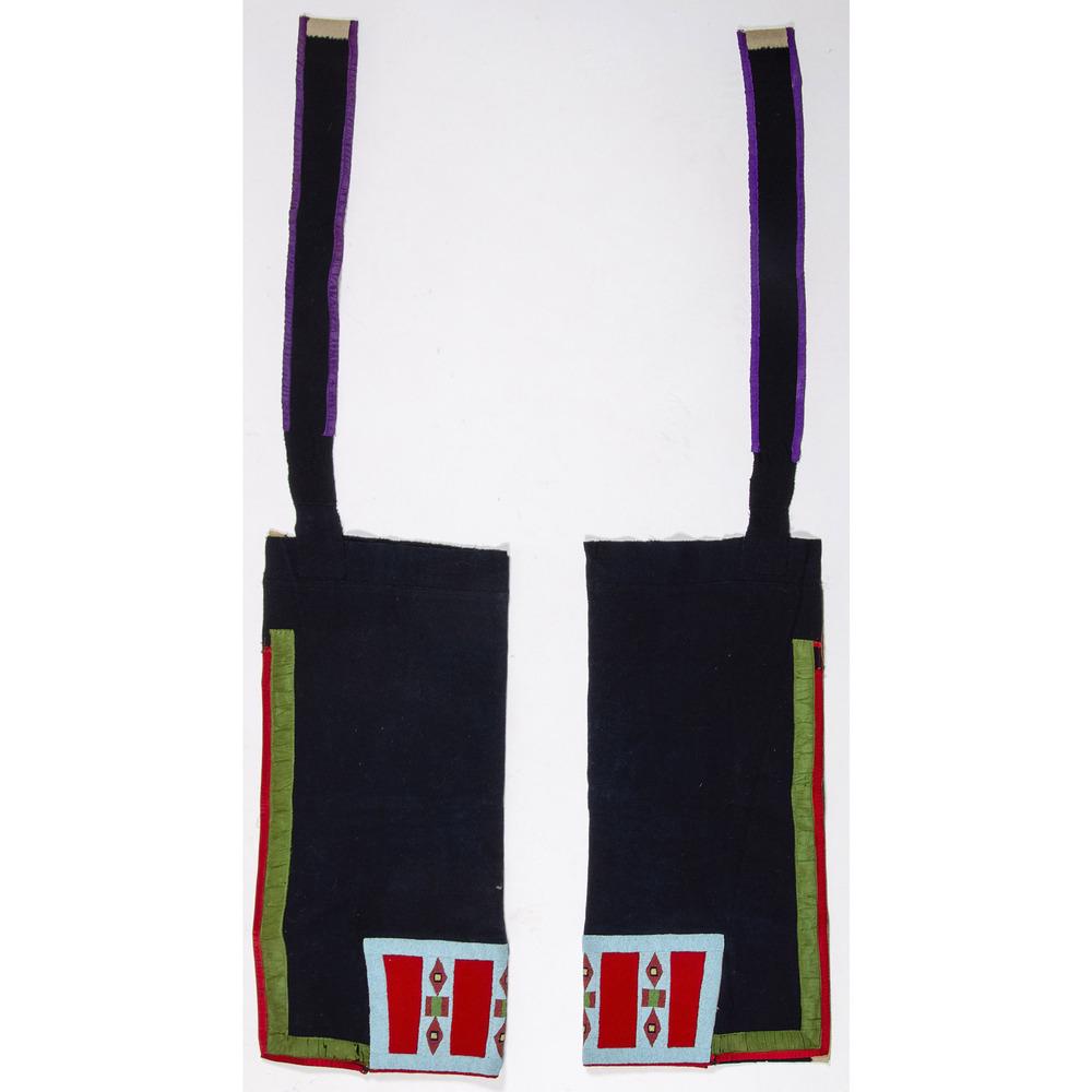 Plateau Beaded Wool Leggings, From the Stanley B.: Plateau Beaded Wool Leggings, From the Stanley B. Slocum Collection, Minnesota navy blue trade wool with white selvedge edge; green and red ribbon line the outer edge and a red wool panel beaded with 