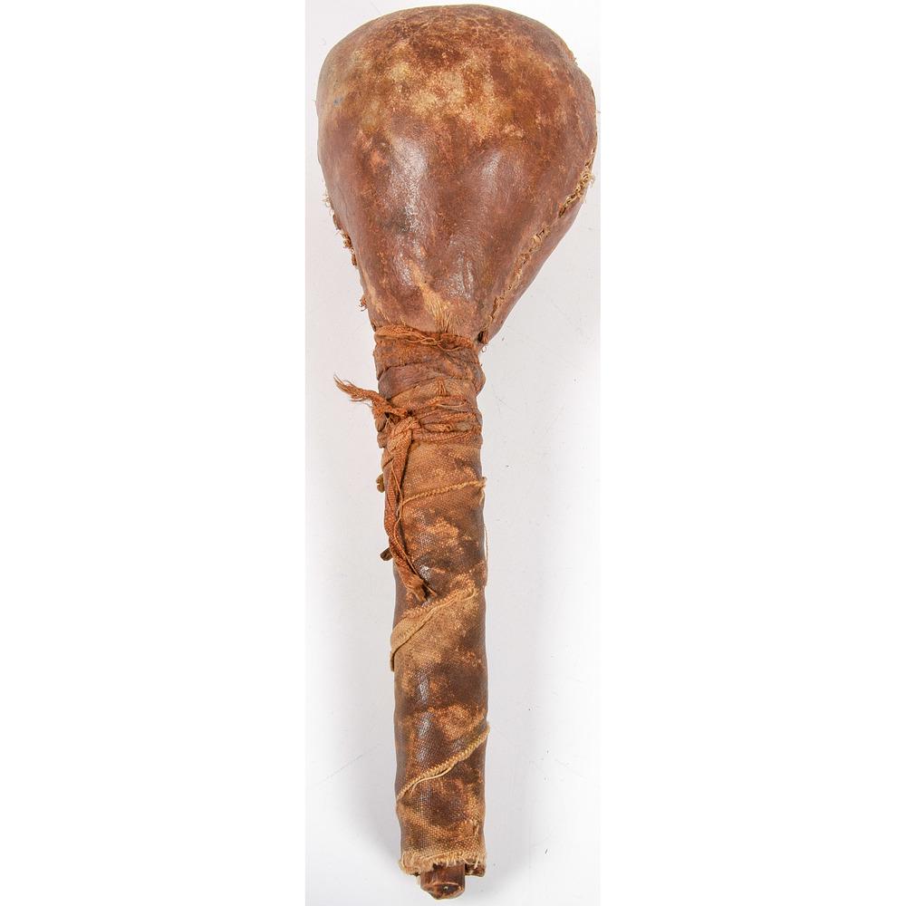 Plains Rawhide Rattle, From the Stanley B. Slocum: Plains Rawhide Rattle, From the Stanley B. Slocum Collection, Minnesota wood handle wrapped with canvas/ oil cloth, length 9 in. early 20th century
