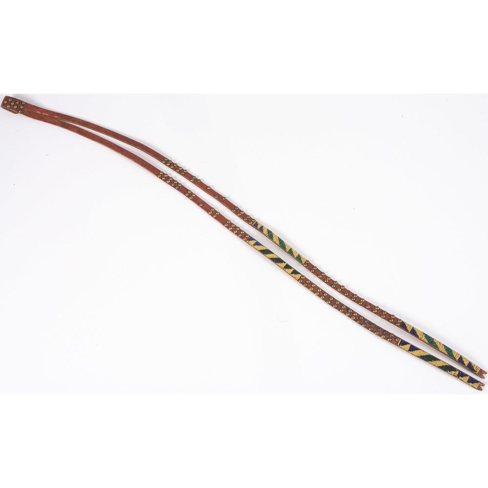 Assiniboine Tacked and Beaded Leather Belt Drop, From: Assiniboine Tacked and Beaded Leather Belt Drop, From the Stanley B. Slocum Collection, Minnesota thread-sewn and beaded with greasy yellow, blue, and green and having brass tacks; length 34 in. mid-2